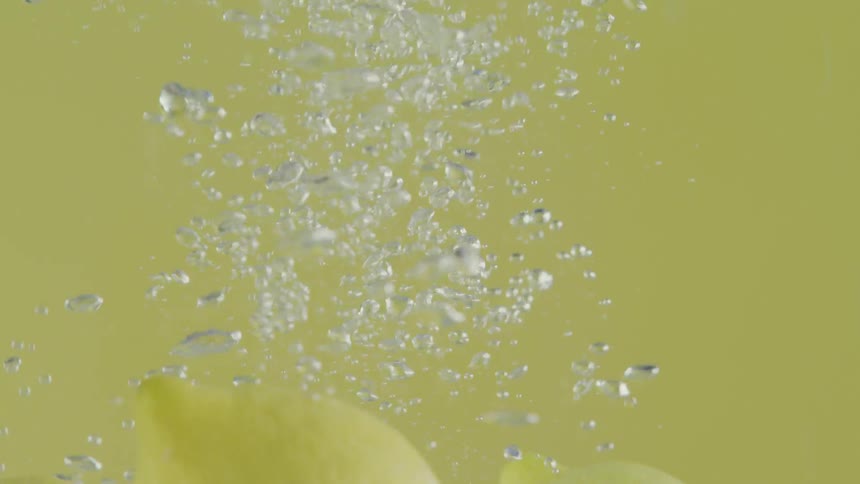 Lemons are dropped into water