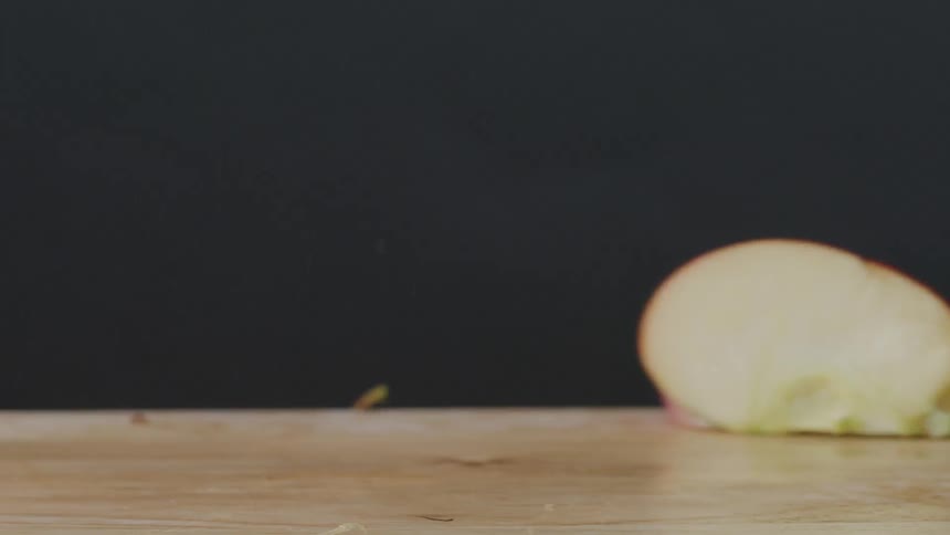 Apple falling and splitting