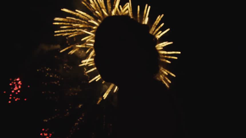 Girl standing in front of fire works