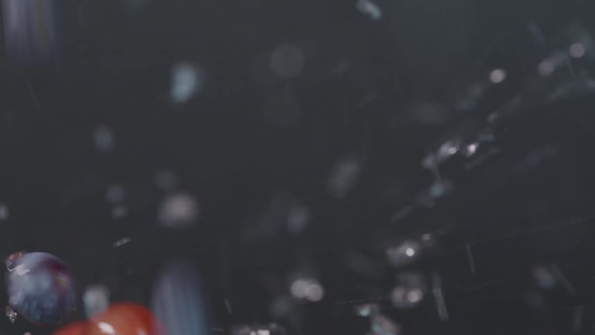 Blueberries and cherries splashing