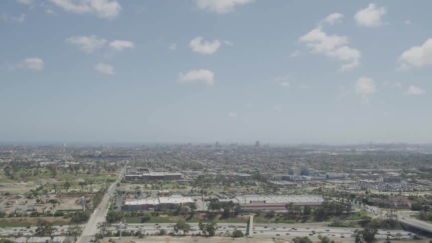 An aerial view of a skyline is displayed