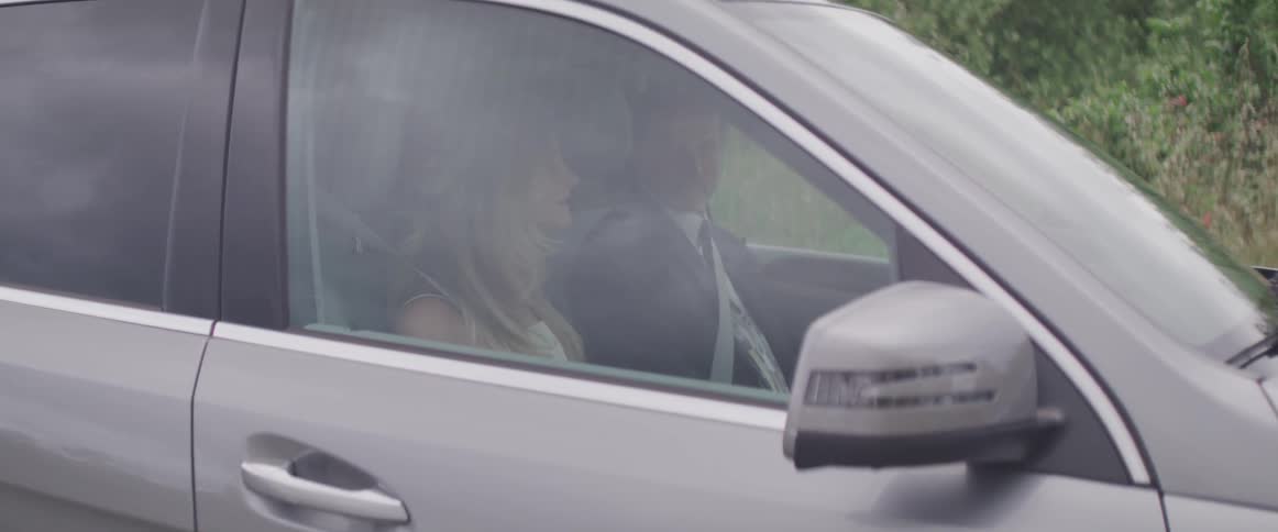 Men and women in a car