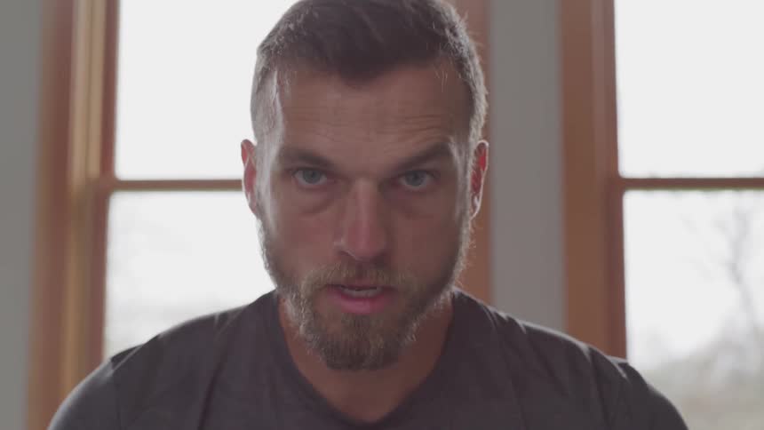 A looks of determined man looking at the camera