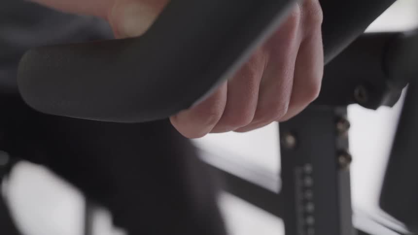 A person works out on a stationary bike