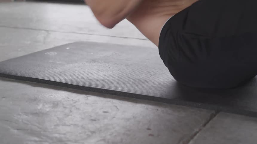 Man working out with a kettle ball