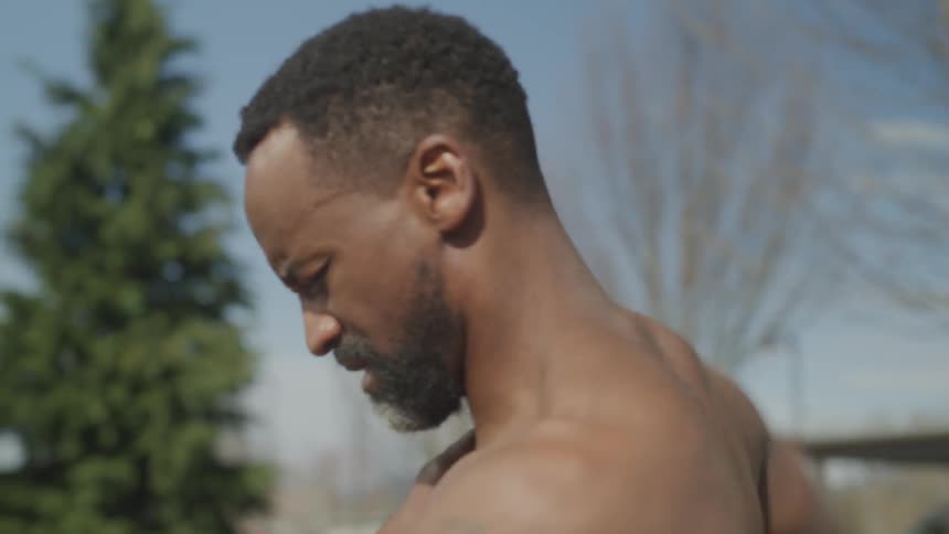 A man is stretching outdoors
