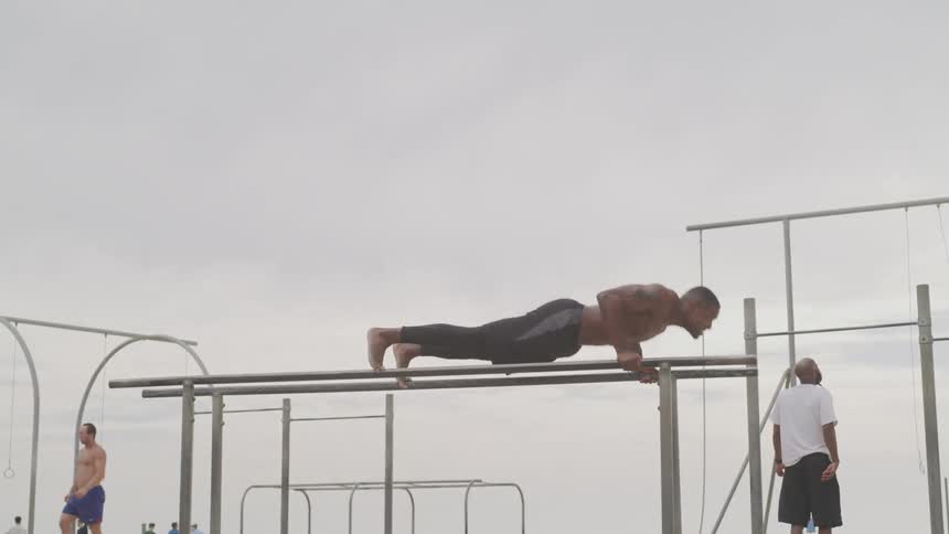 People are outdoors and are working out