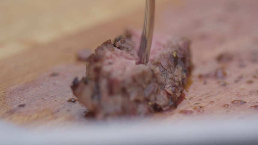 Fork picking up a piece of meat