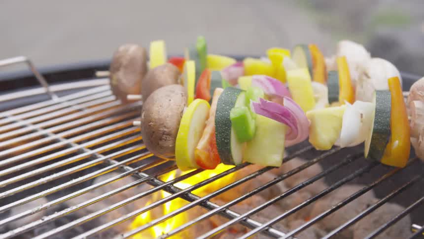 Shish kebabs cooking on a barbecue grill