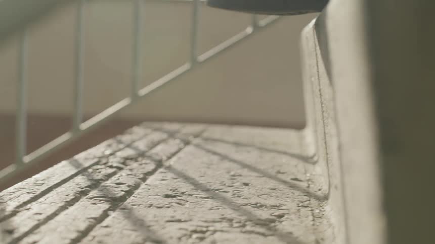 A person runs up cement stairs