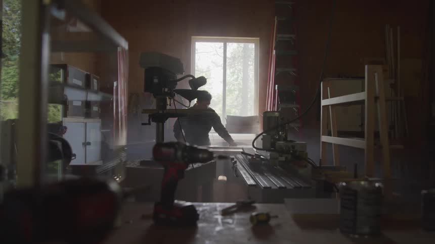 A man is working in a shop