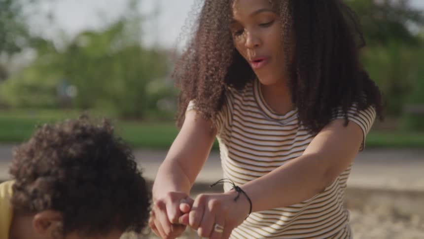 Mother and son are playing outdoors