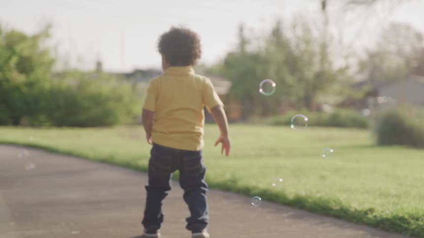 A child is playing outdoors