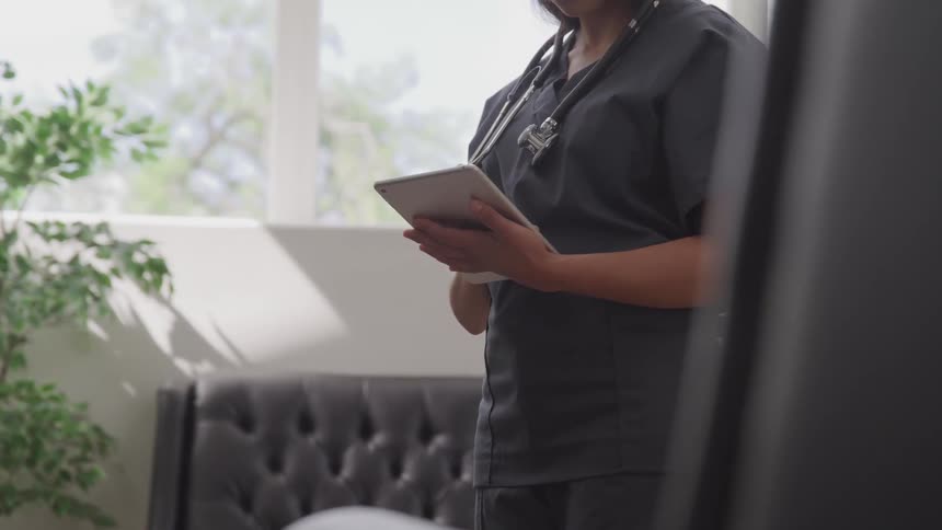 Nurse writing on a pad
