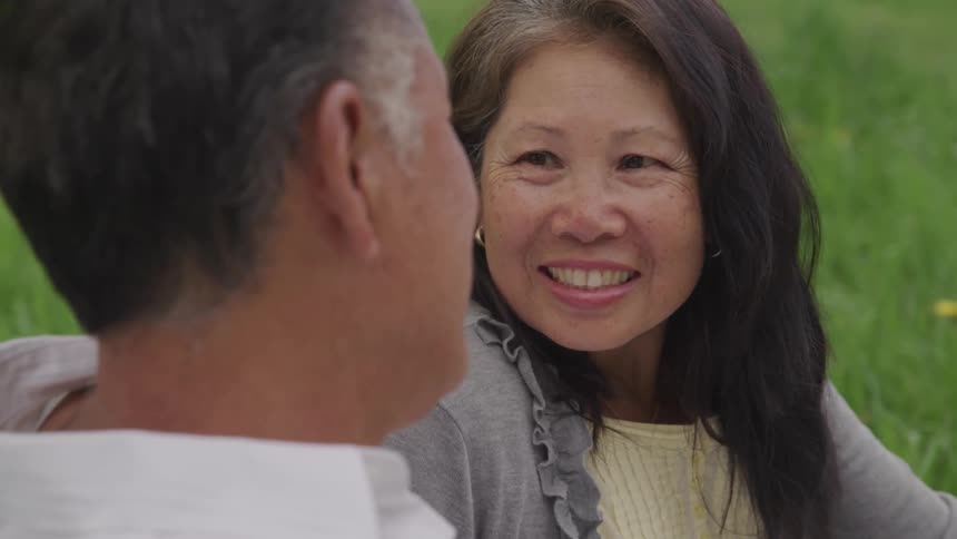 A man and a woman look lovingly at each other