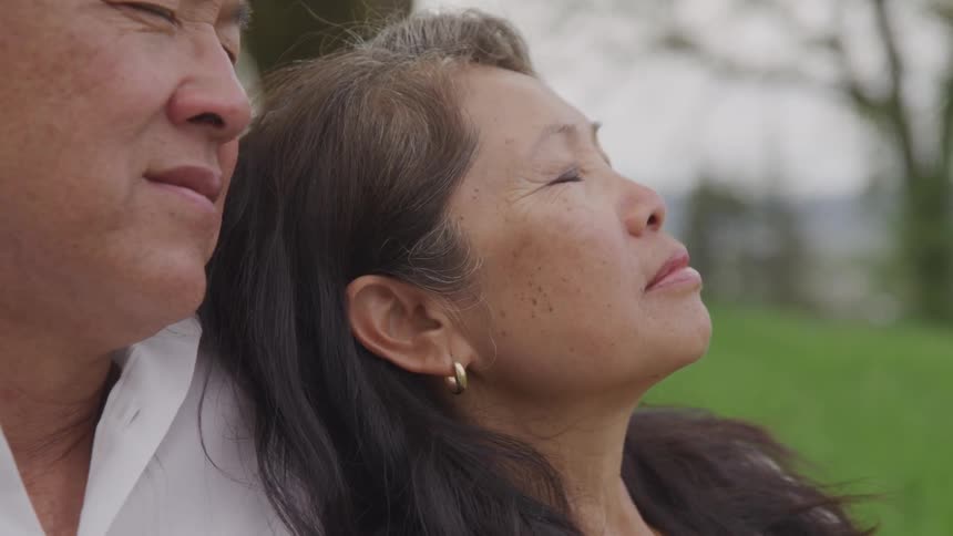 Husband and wife spend some time outside relaxing at day