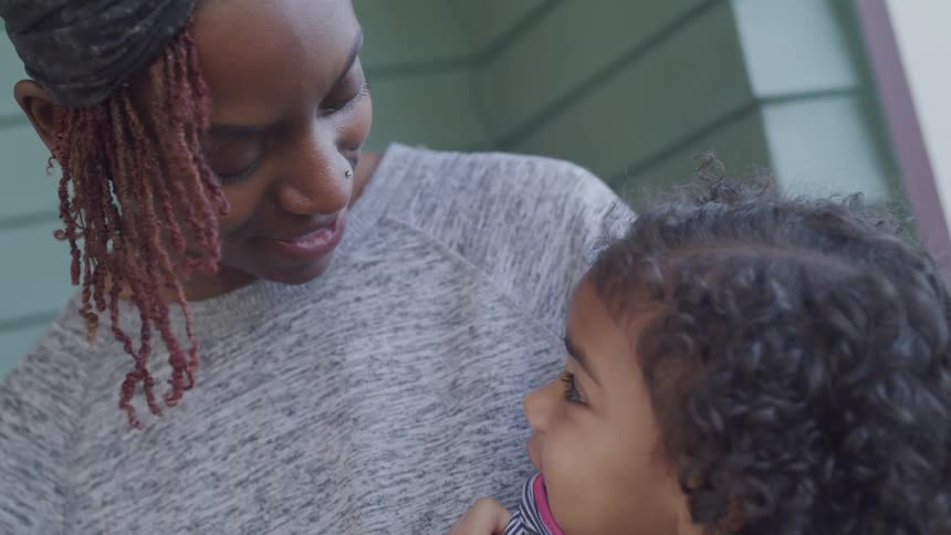 Mother shares a smile with her daughter