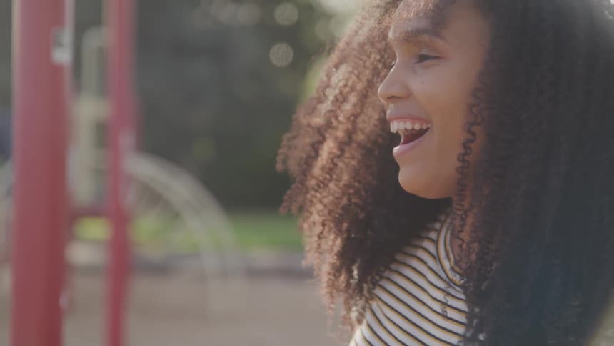 Women laughing at a playground