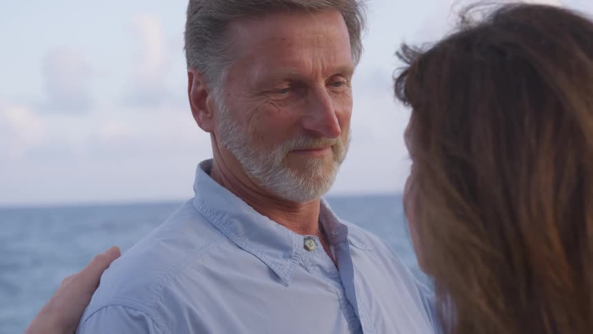 A man looking towards a woman