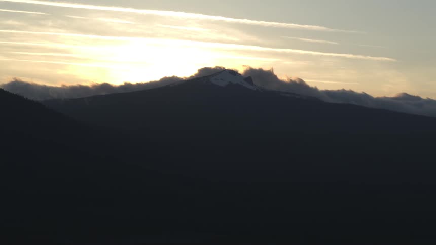 Aerial view of a mountain at sunset