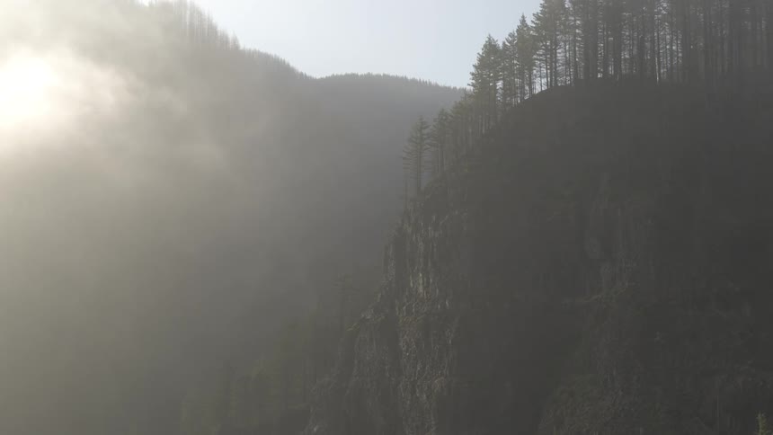The mountain is covered with heavy fog