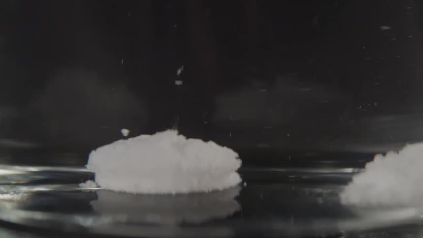 The white substance rises in the water