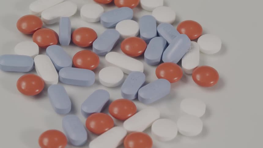 View of the red white and blue pills on the white ground