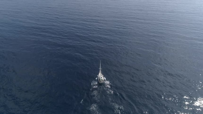 Aerial view of a yacht crossing the ocean