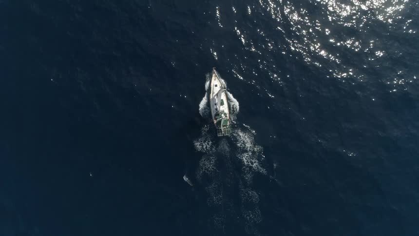 A boat that is sailing across the ocean