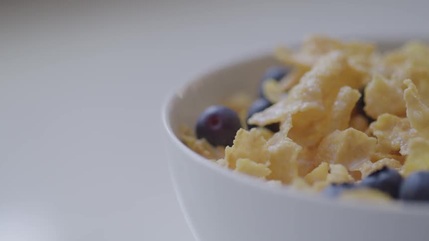 A bowl of cereal and berries for breakfast