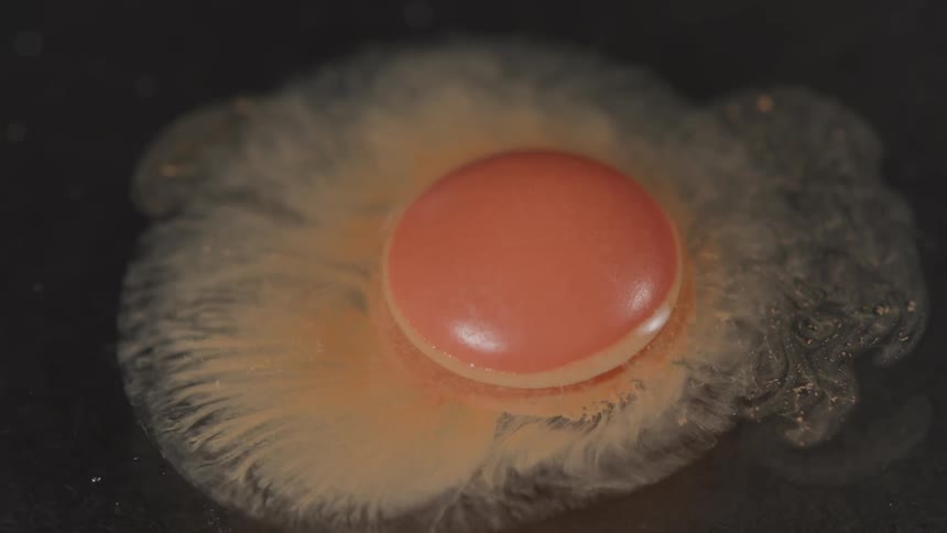 A pill is dissolving in water