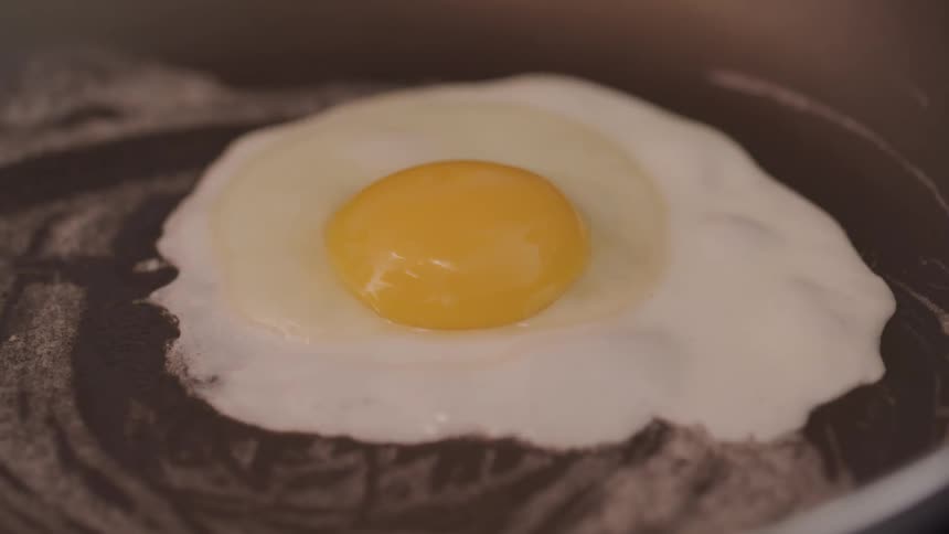 An egg is frying in a skillet