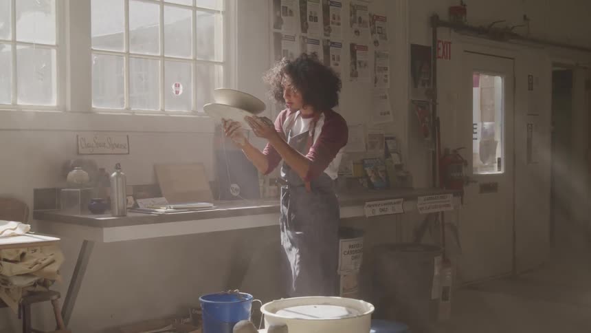 Girl holding pottery