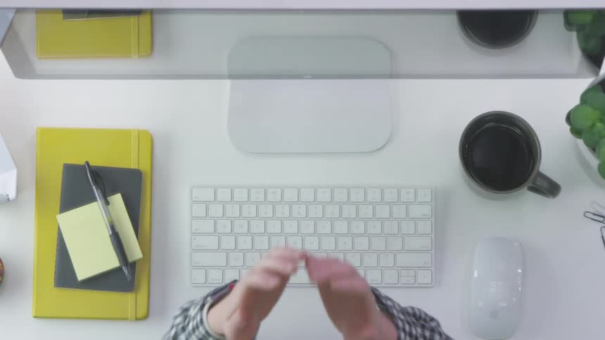 A person typing on a keyboard then realizing they made a mistake