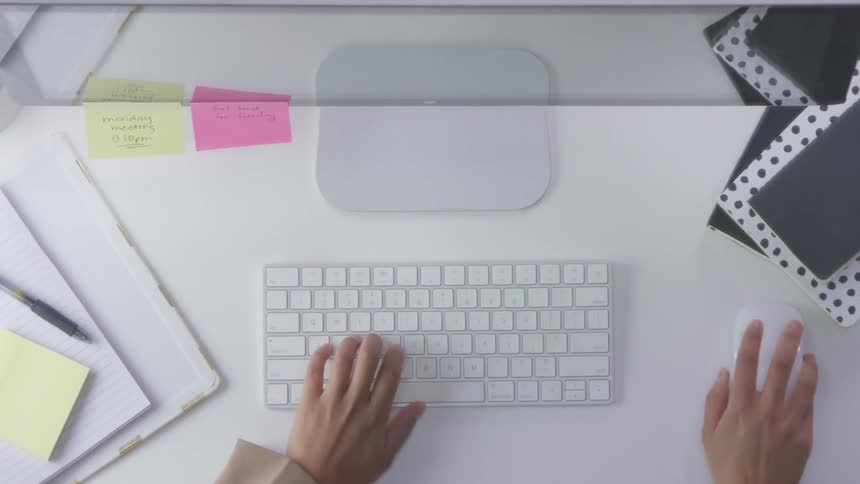 A person types on a keyboard