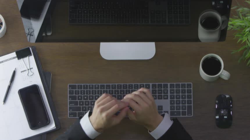 A person is typing on a keyboard