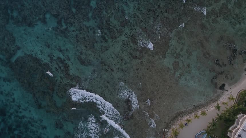 Aerial of coastline and reef in a luxury neighborhood