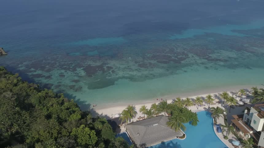 Birds eye view of a beach and hotels