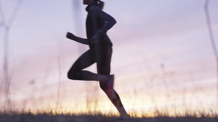 Girl running in the dusk