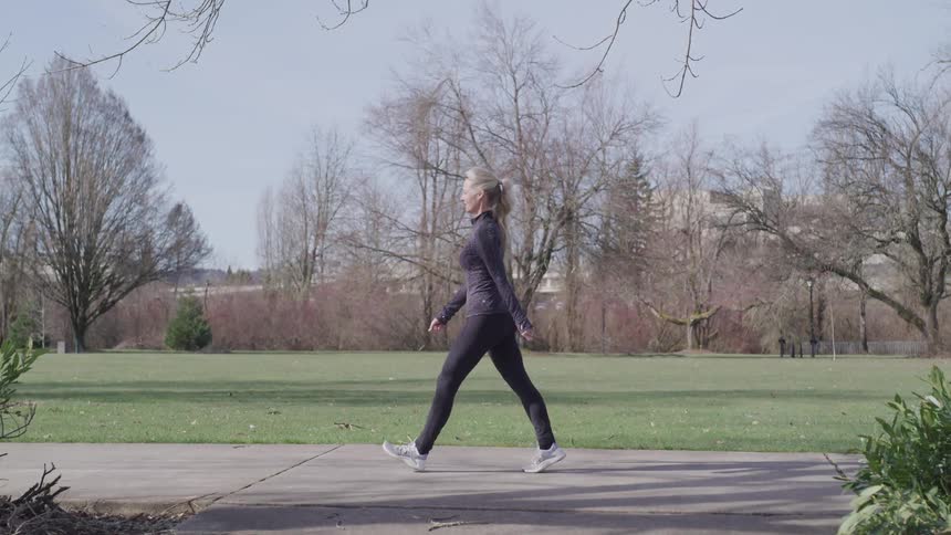 Woman walking alone in the park