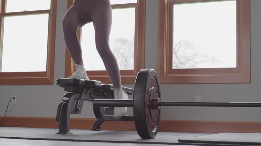 A woman is exercising indoors