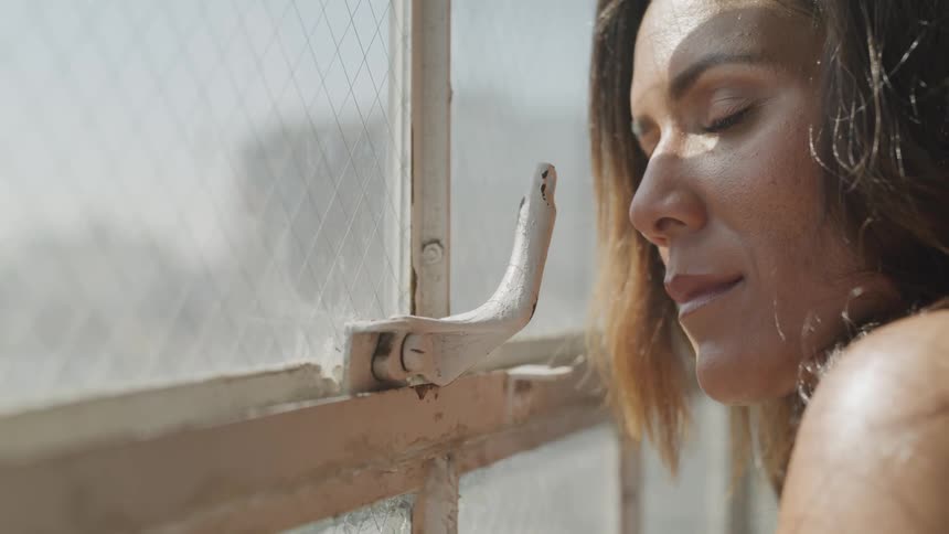 Woman staring out of a window