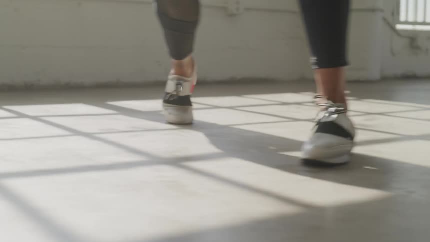 A woman is exercising indoors