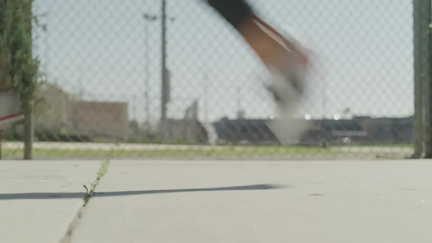 A person runs down a sidewalk