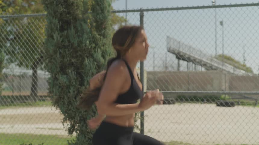 A woman stretches before racing off