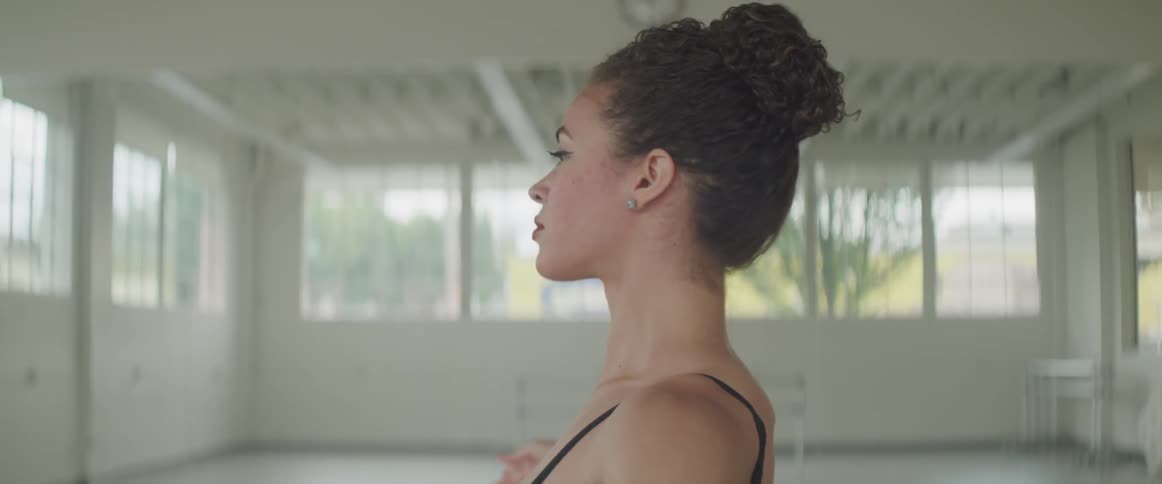 A woman standing in a dance studio