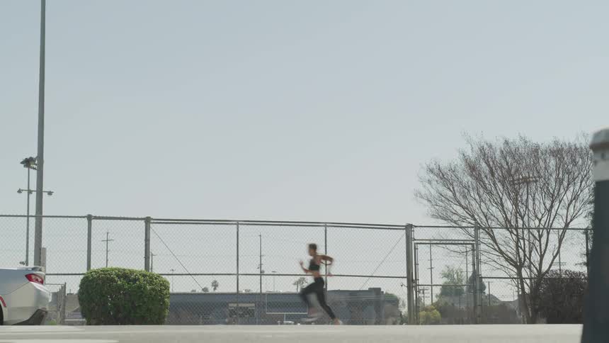 Girl running on the sidewalk