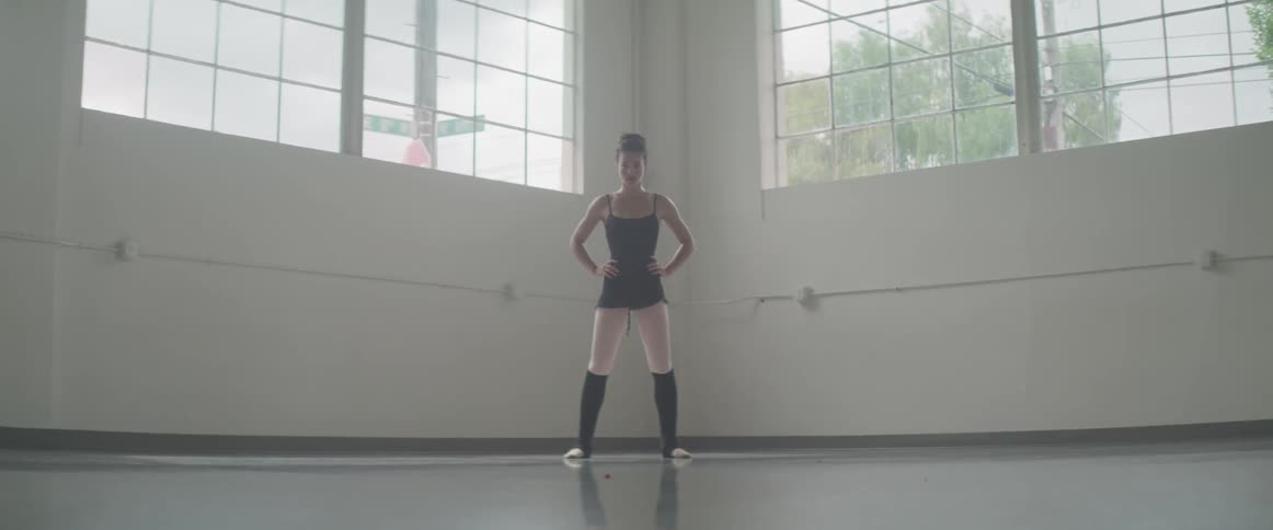 Girl working out in a large room