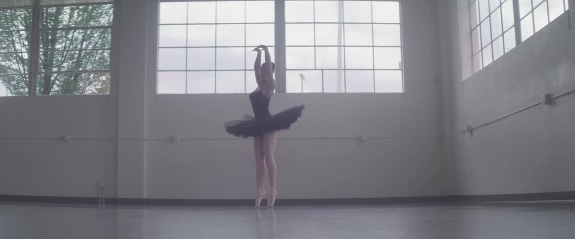 A ballerina turns on her toes