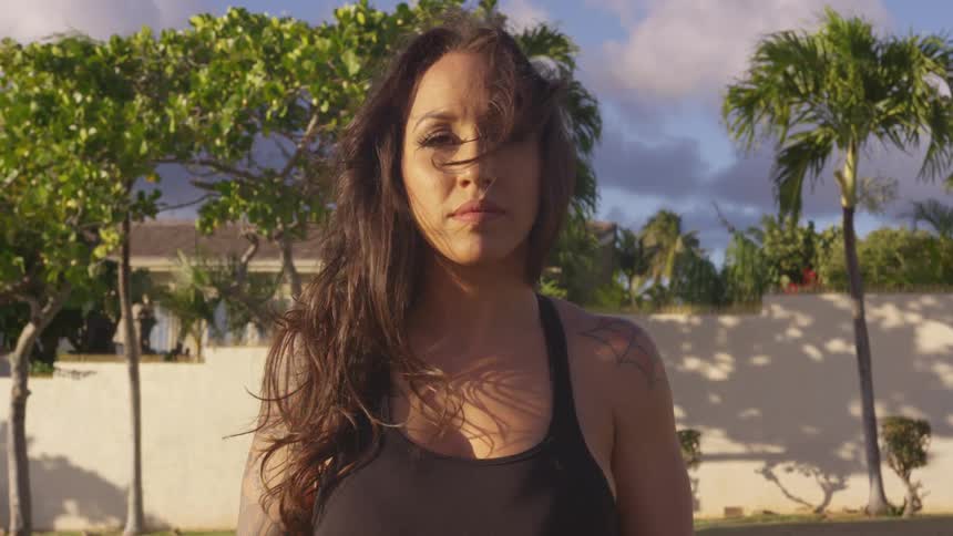 Woman looks into the camera